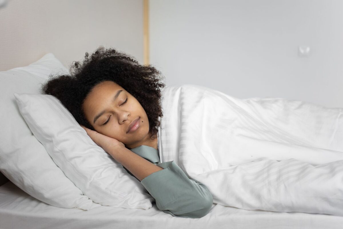 Person sleeping peacefully in bed
